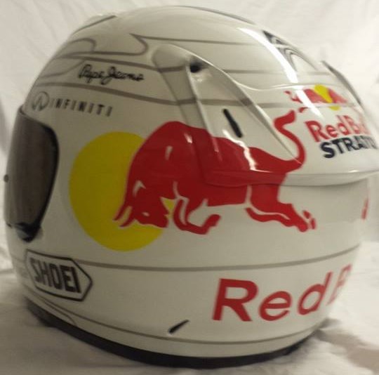 Airbrushed Painting of a White Custom Helmet with Red Bull design